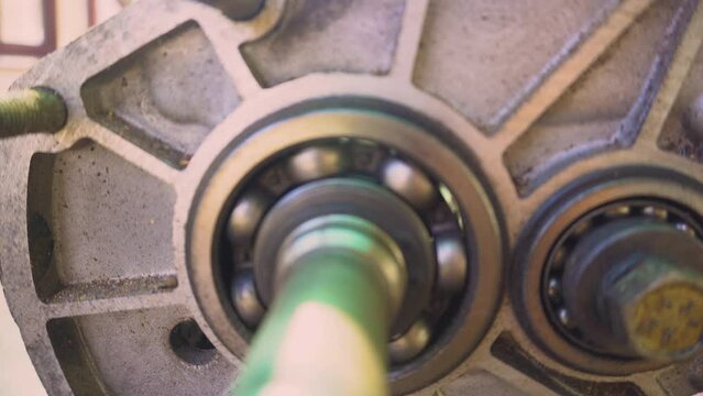 Steel bearing set. Ball radial and tapered plain bearings for mechanical engineering, heavy equipment and machine tools close-up. Spare parts in the form of round bearings of different sizes.