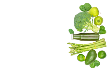 Green smoothie in bottle with green vegetables isolated on white background. top view. diet concept
