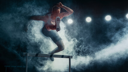 Male Athlete Runner in Mid-ai, Jumping Over Hurdle Amidst Dramatic Smoke and Bright Lights, Exceptional Agility, Strength, and Determination in High-energy Track and Field Event.