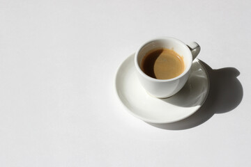 Cup of Black Coffee on White Table Background. Cafe Still Life.