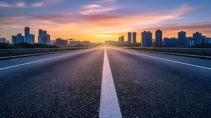 Empty Highway Road with City Skyline at Sunset