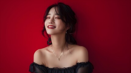 Fototapeta premium Captivating Portrait of a Smiling Hallyu Woman in Classic Little Black Dress on Crimson Red Background