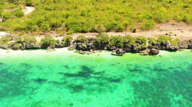 Tropical landscape with rocks and cliffs in coastline area in Bantayan Island beaches. Cebu, Philippines.