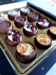Belgium chocolate with cocoa and nuts, sweets close up food photo