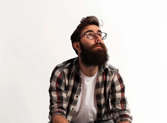 Obraz premium Observing the scene from afar, a bearded man in casual wear sits with his hands on his thighs and looks up at the sky