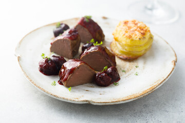 Roasted venison fillet with hot cherries