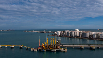 Aerial view oil and gas depot industrial facility for storage logistic petrochemical product, Crude oil and gas depot terminal storage tank petroleum petrochemical refinery product, Business energy.
