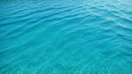 Fototapeta premium A Serene Ocean Seascape, A captivating image of crystal-clear turquoise water gently rippling under the warm sunlight. The tranquil scene evokes a sense of peace, relaxation