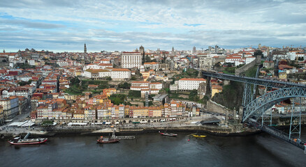 Fototapeta premium Aerial view of the old city and the Don Luis bridge in Porto. High quality photo