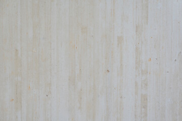 Fototapeta premium Close-up of a concrete surface displaying detailed textures and subtle imperfections. The raw, industrial aesthetic highlights the material's natural characteristics.