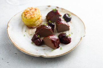 Roasted venison fillet with hot cherries