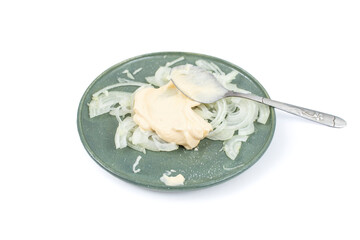 Sliced onion with mayonnaise  on a plate isolated on white background