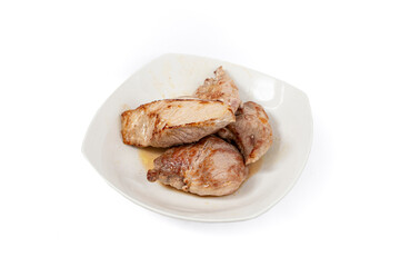 Pork meat pile non a ceramic plate,  close up isolated on white background