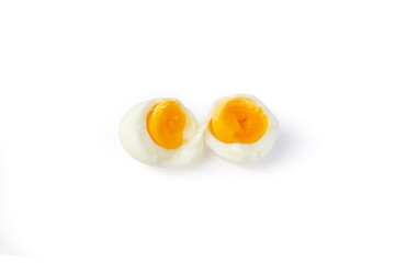 Ripped in half boiled free range egg isolated on white background