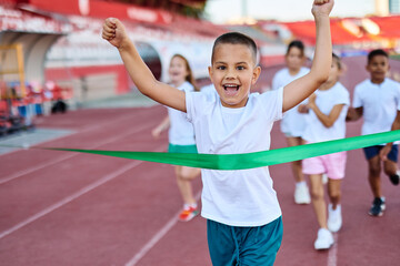 child sport athlete competition running race victory success win winner exercise sprinting runner achievement finish line finish celebration challenge happiness winning motivation excitement