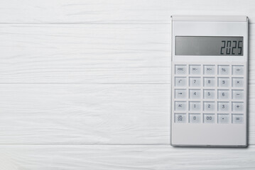2025 on calculator screen. New year 2025 on the calculator display. Concept of new year finance,...