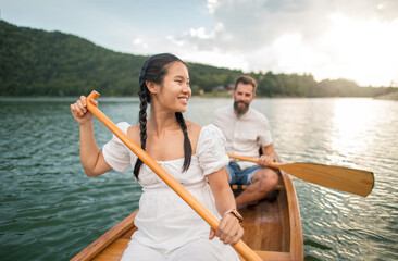 Young couple enjoy time in nature on a boat
