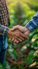 Farmers in a soy field shaking hands to finalize a deal