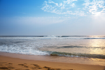 Waves of the Indian Ocean in the rays of the sun