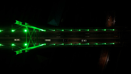 Fototapeta premium Nelson Mandela Bridge At Johannesburg In Gauteng South Africa. City At Night Landscape. Illuminated Cable Bridge. Johannesburg At Gauteng South Africa. Landmark Buildings. Colored Bridge.