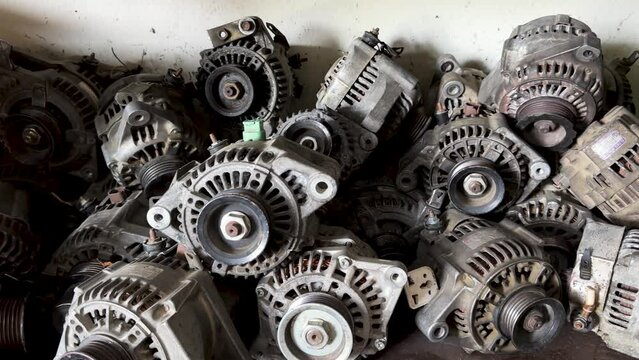 Old Car Alternators in a Workshop