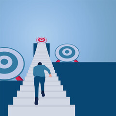 A man runs up the stairs towards a target above even though there are other targets on either side, an illustration of focus.