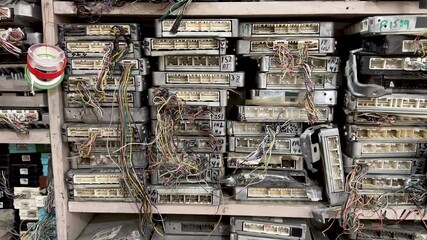 Stacked Electronic Control Units (ECUs) in a Workshop