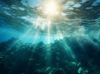 Fototapeta premium Sunbeams pierce through the surface of a calm ocean, creating a mesmerizing underwater spectacle.