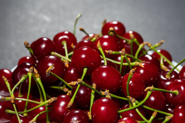 juicy and ripe cherries on dark background