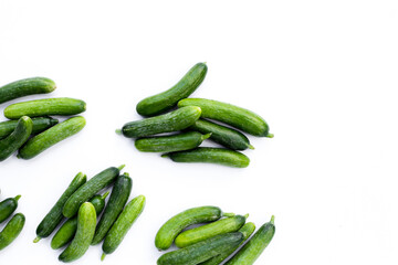 Mini cucumbers on white background.