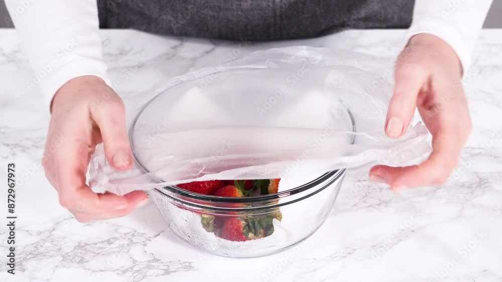 Wall mural Washed and Dried Strawberries Stored Safely in a Glass Bowl