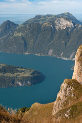 Lake in a valley seen from Fronalpstock summit in Switzerland. Swiss Alps iconic view