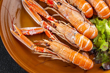 langoustine tasty seafood shrimp prawns delicious fresh meal food snack on the table copy space food background rustic top view keto or paleo diet Pescetarian