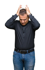Handsome middle age arab business man over isolated background suffering from headache desperate and stressed because pain and migraine. Hands on head.