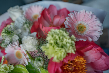 Spring delicate bouquet for birthday. Bouquet of green anthurium, pink peonies and other spring flowers