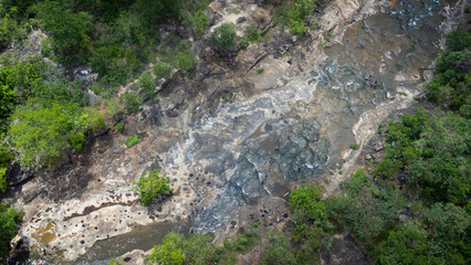 River stream waterfall in forest landscape, beautiful nature water stream with rocks in the tropical forest.Abundant forest.