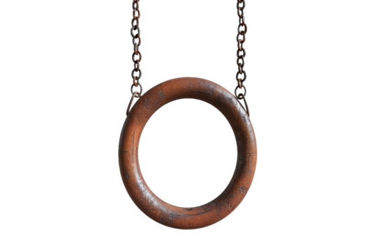 A rusty metal circle with a chain hanging from it