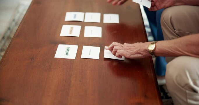 Mental health, therapy and people with memory game for senior care, dementia or mind assessment. Healthcare, elderly person and caregiver for card test, puzzle or alzheimer evaluation in nursing home