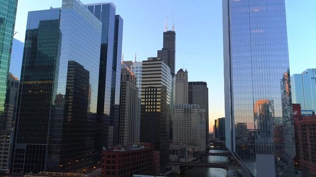 Aerial Chicago panorama above Downtown skyscrapers, Flying Сhicago street evening - Aerial View, Flying above Сhicago skyline blue at sunrise. Aerial view of the city of Сhicago dramatic
