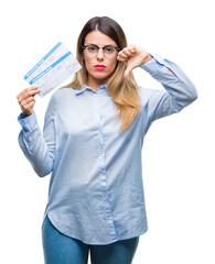 Young beautiful woman holding boarding pass over isolated background with angry face, negative sign showing dislike with thumbs down, rejection concept