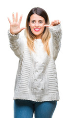 Young beautiful woman casual white sweater over isolated background showing and pointing up with fingers number six while smiling confident and happy.