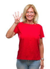 Middle age blonde woman over isolated background showing and pointing up with fingers number four while smiling confident and happy.