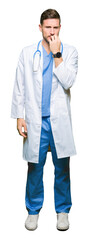 Fototapeta premium Handsome doctor man wearing medical uniform over isolated background looking stressed and nervous with hands on mouth biting nails. Anxiety problem.