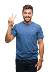 Fototapeta premium Young handsome man over isolated background showing and pointing up with fingers number two while smiling confident and happy.