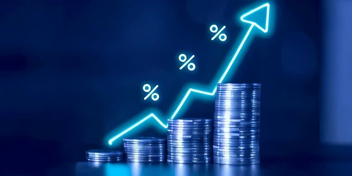 A stack of coins with an arrow pointing upwards and glowing percent icon showing financial growth and investment concept