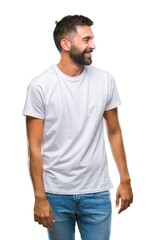 Obraz premium Adult hispanic man over isolated background looking away to side with smile on face, natural expression. Laughing confident.