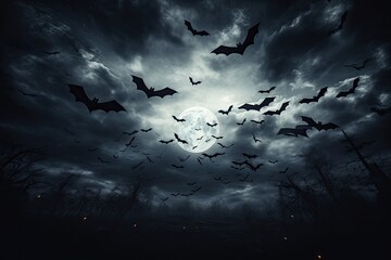 Spooky moon in cloudy sky with bats Halloween night