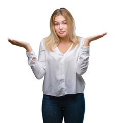 Young caucasian woman over isolated background clueless and confused expression with arms and hands...