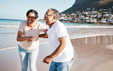 Outdoor, laughing and senior couple at beach for happiness, funny joke or summer getaway trip....