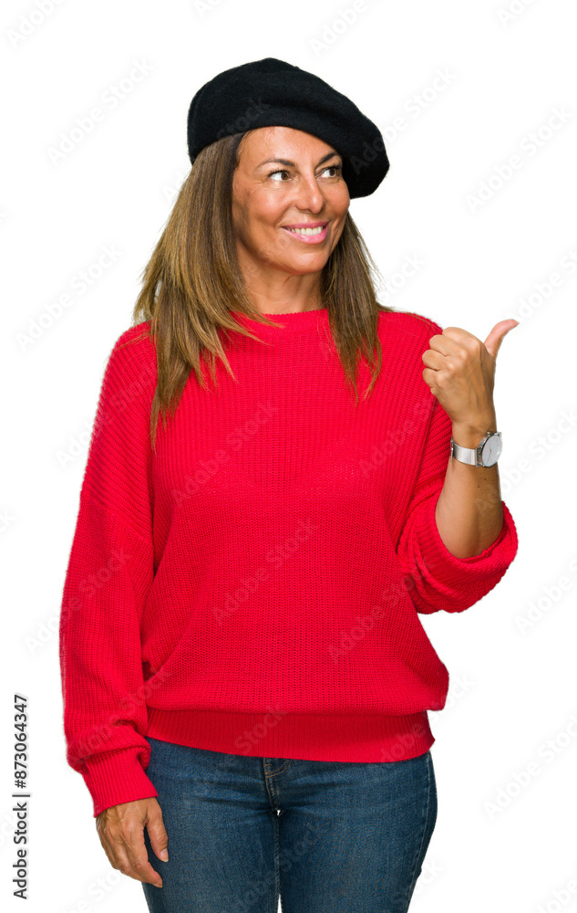 Wall mural middle age adult woman wearing fashion beret over isolated background smiling with happy face lookin